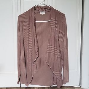 NWOT brownish flowy cardigan that has this cool design all over it.